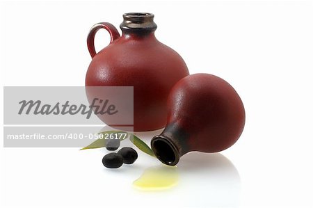 two old jugs with olive oil and olives