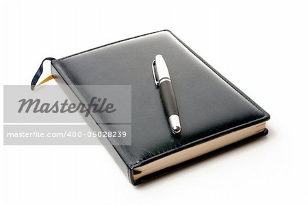 Notebook and pen isolated on a white background