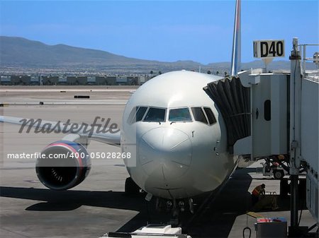 Airplane parked at gate at McCarran International Airport in Las Vegas, Nevada.