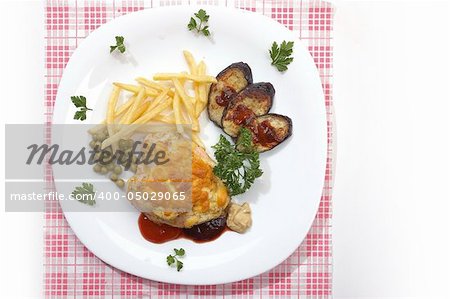 appetizing dish: chicken fillet with green peas, fry potatoes and grilled aubergine