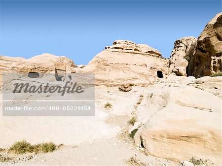 Tombs in Petra - Nabataeans capital city (Al Khazneh) , Jordan. Made by digging a holes in the rocks. Roman Empire period.