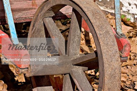 A closeup of an old wheelbarrow wheel in Allaire Village, New Jersey. Allaire village was a bog iron industry town in New Jersey during the early 19th century.