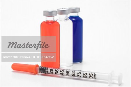 Medicine vials and syringe.