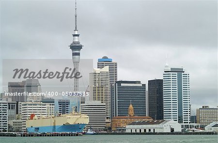 Auckland Skyline and Harbor with large container ship at the dock
