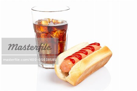 A hot dog and soda glass reflected on white background. Shallow DOF