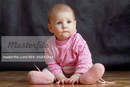 little baby sitting on the floor, portrait