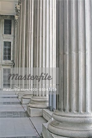 Stone Pillars Outside a Court during the day