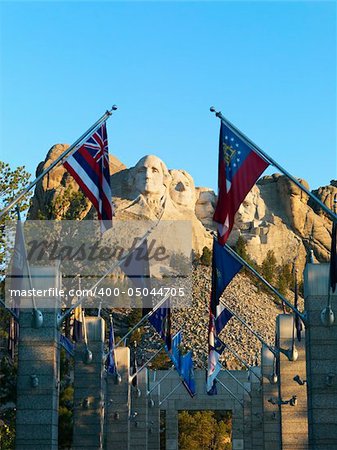 Mount Rushmore National Memorial as seen from entrance with state flags.