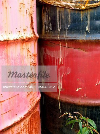 Old oil drums with streaks reminding you of what they once contained