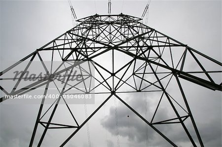Close view of a high tension pole on a cloudy day