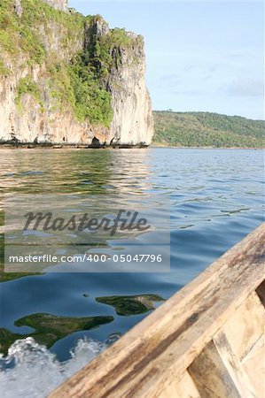 View from a boat of mountains and water.