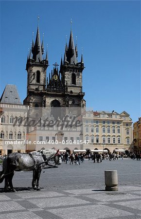 Cathedral on the Old town square and a hors in front of it.