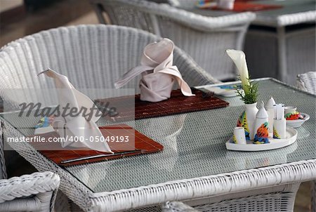 The served table at restaurant with bouquet