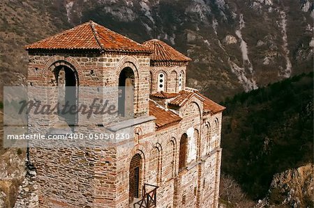 Old antique ortodox church in mountains with trees