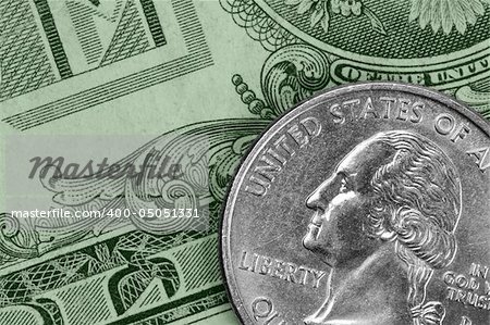 Closeup of U.S. money: a quarter and a dollar bill