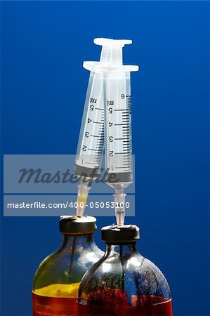 Syringe sticking in the bottle.