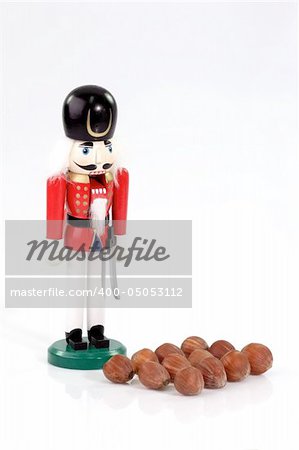 Nutchracker man with nuts on bright background