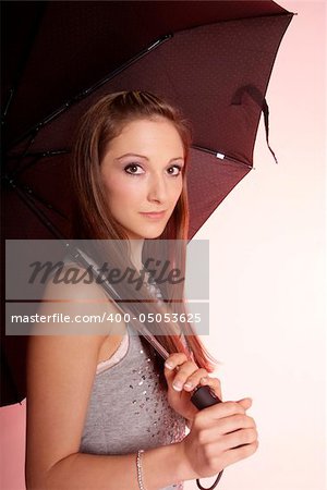 pretty woman with long brown hair and umbrella