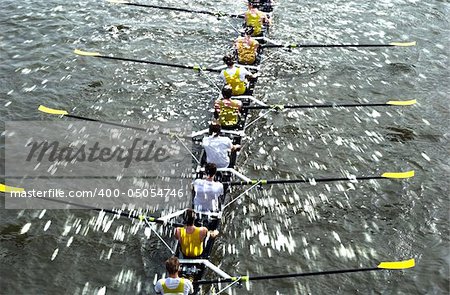 Water Background with rowers in eight-oar rowing boat