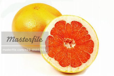 Whole juicy grapefruit and sliced half isolated