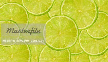 Background of fresh juicy lime slices on a large heap