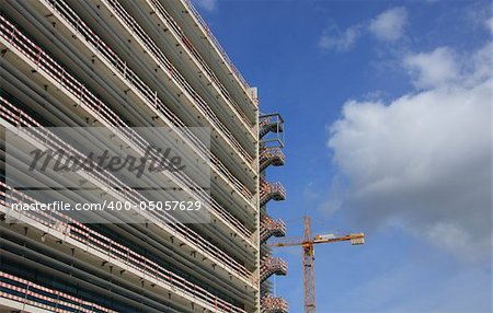 Crane working at a construction site with space for text