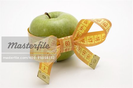 Green Apple with measuring tape.