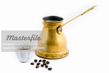 Arab small copper coffee pot with cup and coffee beans isolated on white