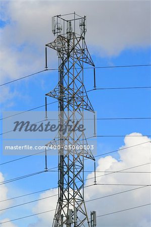 Top of the electricity pylon over cloudscape.