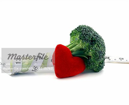 Fresh broccoli healthy heart and lifestyle concept over a white background