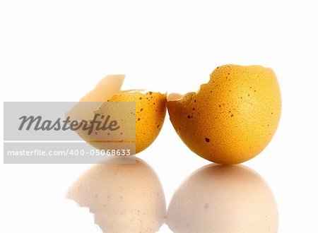 Broken eggshell on white background