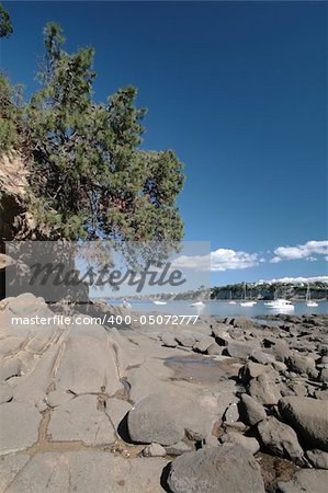 Jagged odd shaped rocks shaped by the water tides over the years