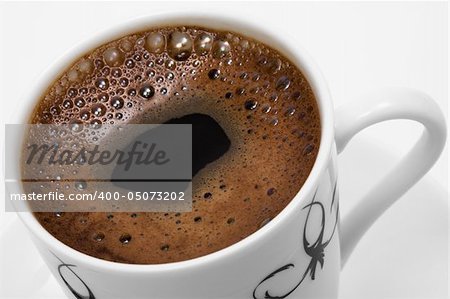 Beautiful white cup with strong black coffee