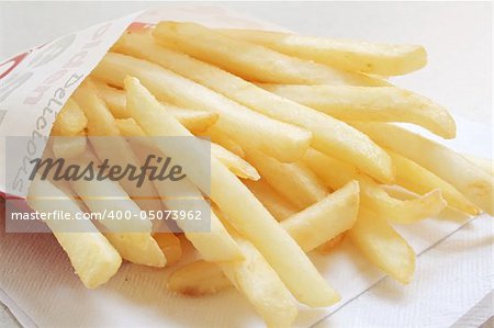 French Fries from a Fastfood Chain on a white table