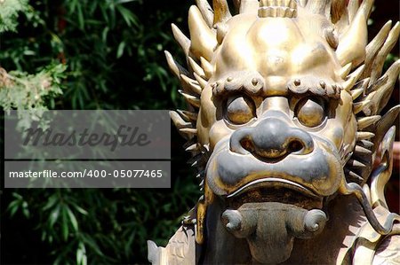 A bronze of a lion inside the forbidden city in beijing.