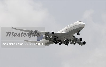 Heavy widebody passenger airplane in flight landing