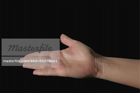 hand holding invisible object - deep black background