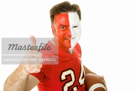 Football fan in jersey and face paint giving a thumbs up sign.  Isolated on white.