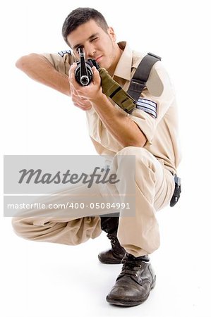 soldier going to shoot with gun on an isolated background