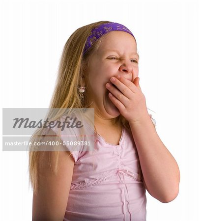 Girl yawning from being tired and exhausted over white