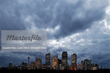 Dark clouds above sydney cbd, lights in buildings, night scene