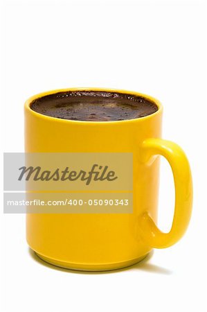 Yellow mug from coffee on a white background