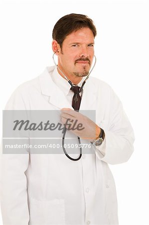 Handsome doctor listening to his own chest with a stethoscope.  Isolated on white.