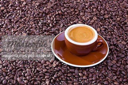 espresso cup and coffee beans on white background