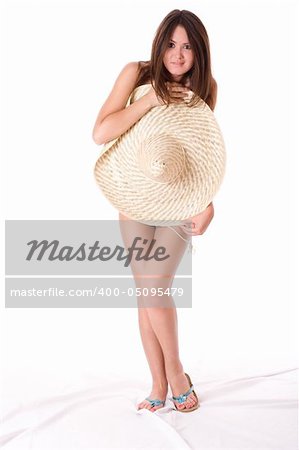 Sexy girl. Being covered with the big hat. Isolated on white background