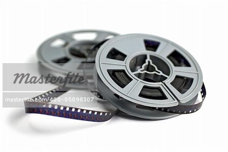 still life of 8mm cine film and reels; isolated on white ground; differential focus