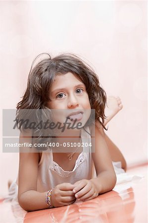 Studio portrait of  nice little girl having good time