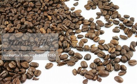 Coffee Beans spread on a white background