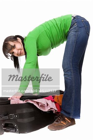 woman packs her clother. over white background