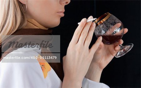 young girl smoking cigarette and drinking red wine